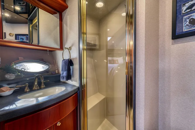 Slide: The Image of Luxurious bathroom in 2004 West Bay SonShip 72 Motoryacht with elegant fixtures and shower. - 22