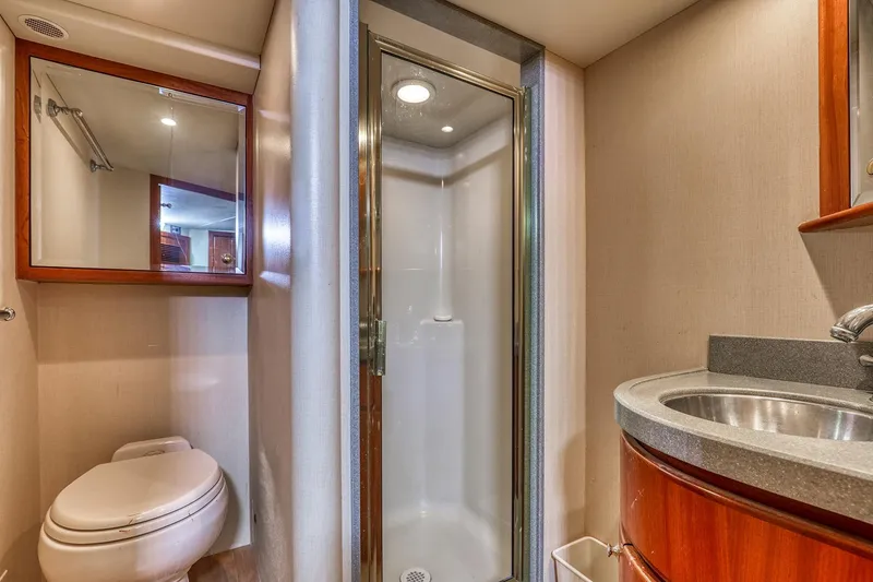 Slide: The Image of Luxurious bathroom in 2004 West Bay SonShip 72 Motoryacht with shower, sink, and toilet. - 26
