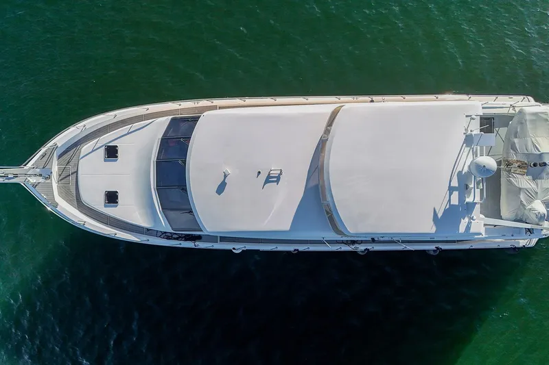 Slide: The Image of Aerial view of 2004 West Bay SonShip 72 Motoryacht on green water. - 3
