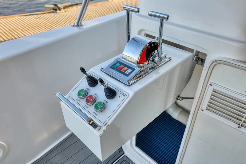 Slide: The Image of Control panel of a 2004 West Bay SonShip 72 Motoryacht, featuring throttle and joystick controls. - 5
