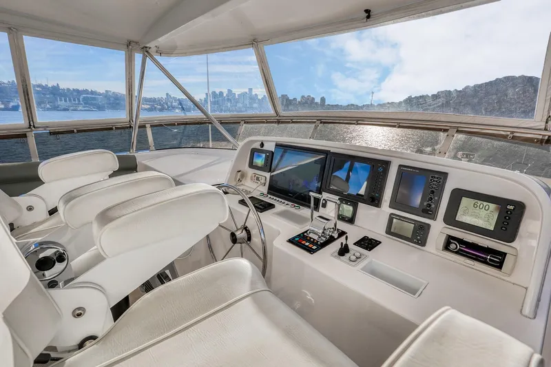 Slide: The Image of Helm of 2004 West Bay Sonship Motoryacht with modern navigation equipment and panoramic views. - 9