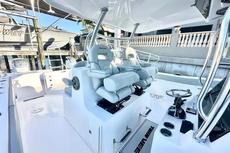Slide: The Image of 2023 Twin Vee 340 GFX CC boat interior with modern seating and steering console. - 10