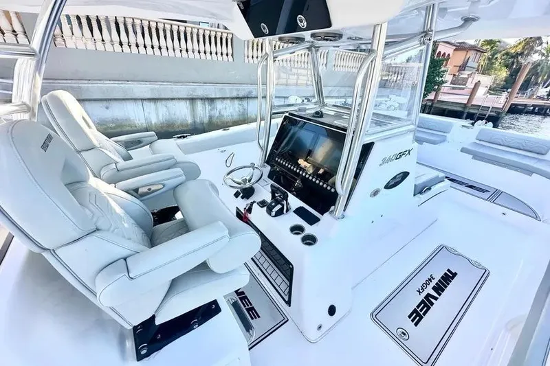 Slide: The Image of 2023 Twin Vee 340 GFX CC boat interior with modern helm and seating. - 9