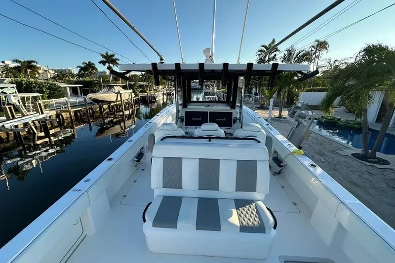 Slide: The Image of 2022 Invincible 35 Catamaran docked, showcasing spacious seating and modern design. - 10