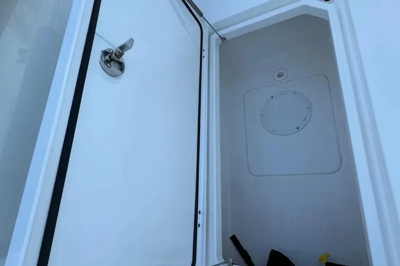 Slide: The Image of Open storage compartment on 2022 Invincible 35 Catamaran boat. - 24