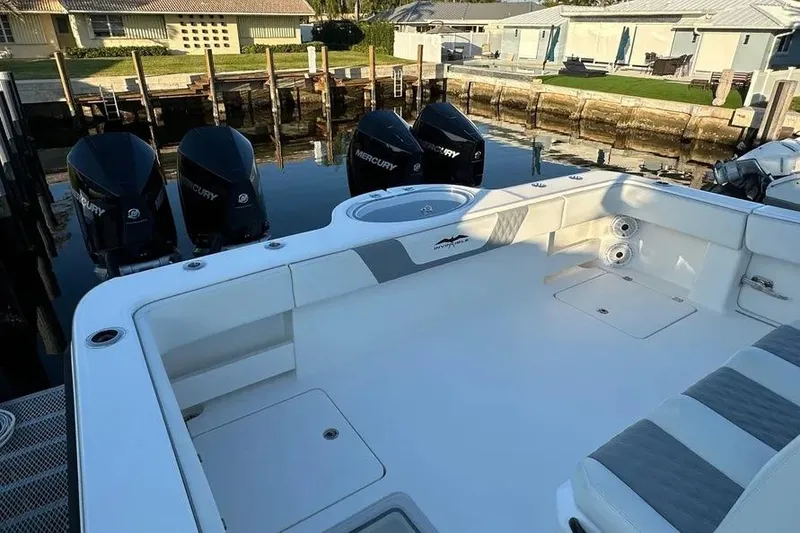 Slide: The Image of 2022 Invincible 35 Catamaran with Mercury engines docked at a marina. - 40