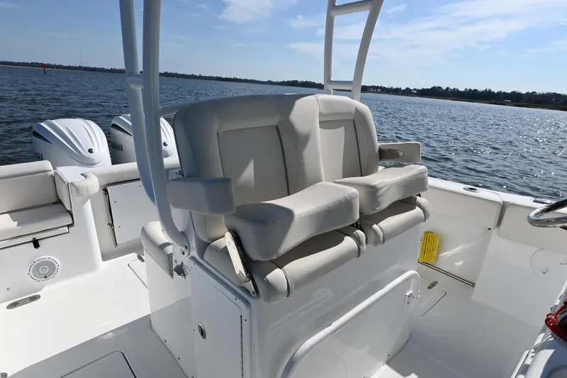 Slide: The Image of 2024 Sea Hunt Gamefish 28 boat interior with dual seats and ocean view. - 12