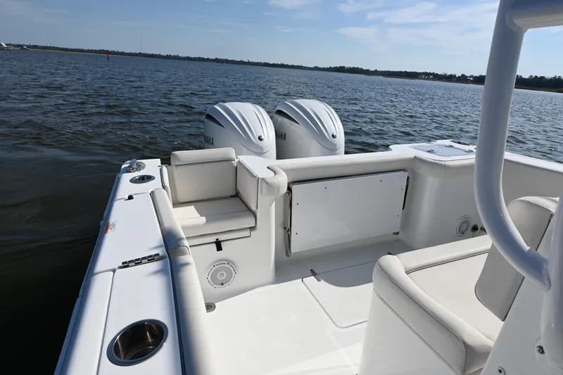 Slide: The Image of 2024 Sea Hunt Gamefish 28 boat interior with dual engines on open water. - 16