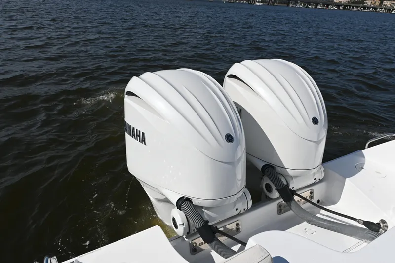 Slide: The Image of 2024 Sea Hunt Gamefish 28 with twin Yamaha outboard engines on water. - 18