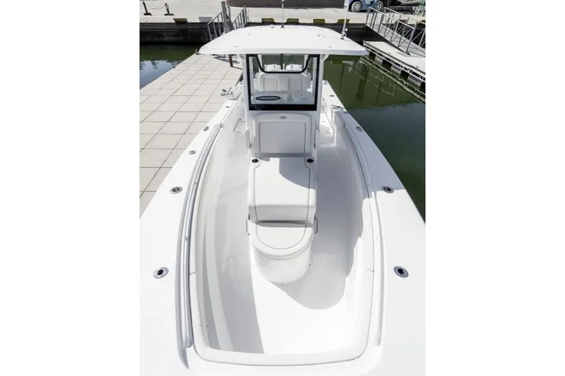 Slide: The Image of 2024 Sea Hunt Gamefish 28 boat on water near a bridge. - 3