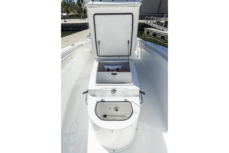Slide: The Image of 2024 Sea Hunt Gamefish 28 boat on calm water, featuring spacious seating and sleek design. - 6