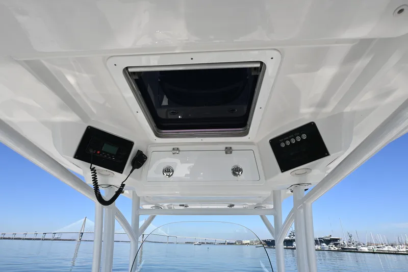 Slide: The Image of 2020 Sea Fox 288 Commander boat interior with control panel and ocean view. - 11