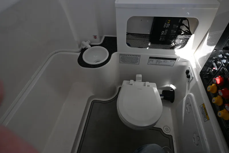 Slide: The Image of 2020 Sea Fox 288 Commander boat bathroom with toilet and sink. - 19