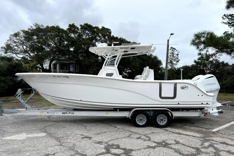 Slide: The Image of 2020 Sea Fox 288 Commander boat on trailer, parked outdoors. - 23