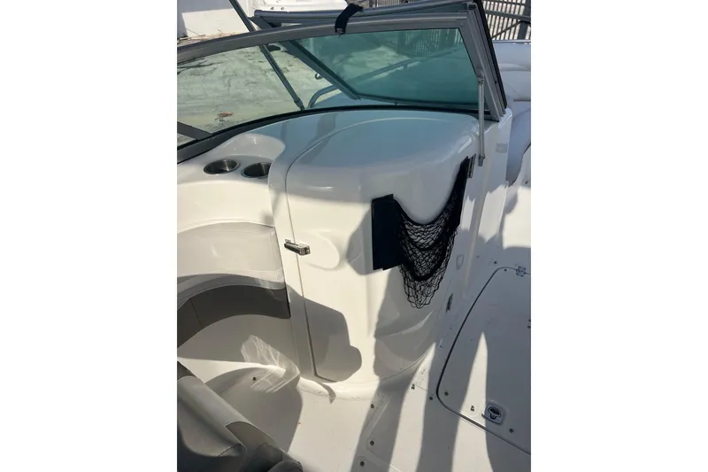 Slide: The Image of 2017 Hurricane SunDeck 2200 DC OB boat interior with seating and storage net. - 14