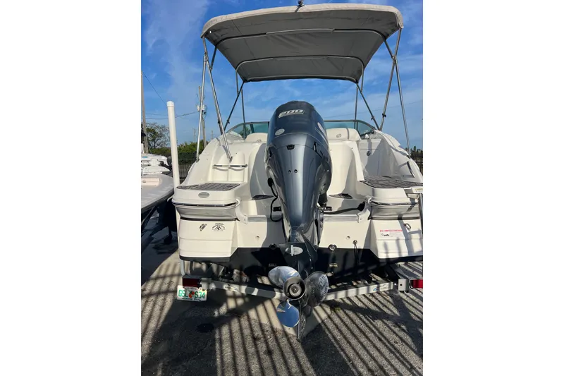 Slide: The Image of 2017 Hurricane SunDeck 2200 DC OB boat with outboard motor and canopy. - 2