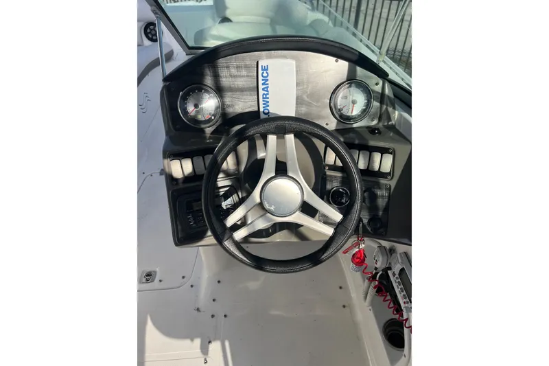 Slide: The Image of 2017 Hurricane SunDeck 2200 DC OB boat dashboard with steering wheel and gauges. - 4