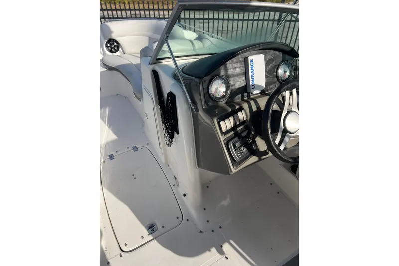 Slide: The Image of 2017 Hurricane SunDeck 2200 DC OB boat interior with steering wheel and dashboard controls. - 5