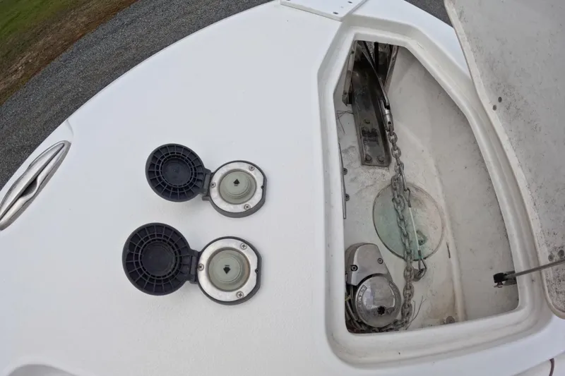 Slide: The Image of 2019 Sea Hunt Gamefish 25 anchor locker with chain and deck fittings. - 8