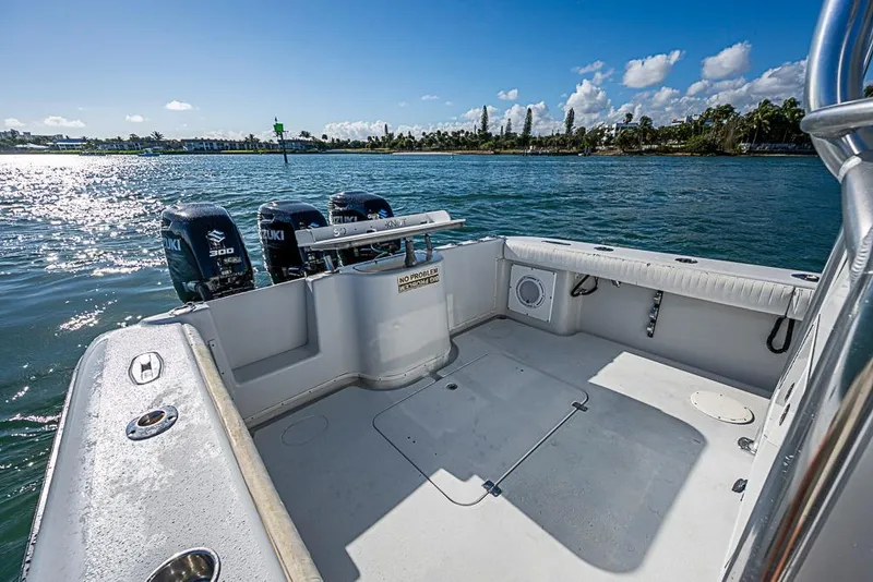 Slide: The Image of 2002 Yellowfin 36 Offshore boat with Suzuki engines on a sunny day. - 11