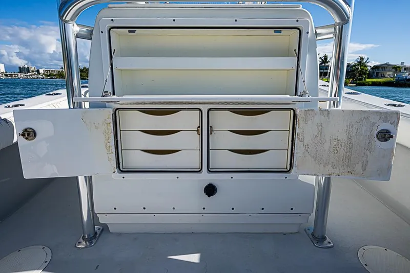 Slide: The Image of 2002 Yellowfin 36 Offshore boat storage compartments open on deck. - 14