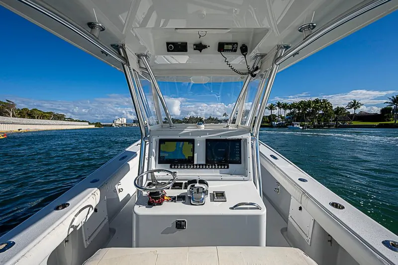 Slide: The Image of 2002 Yellowfin 36 Offshore boat cockpit with navigation equipment on a sunny day. - 15