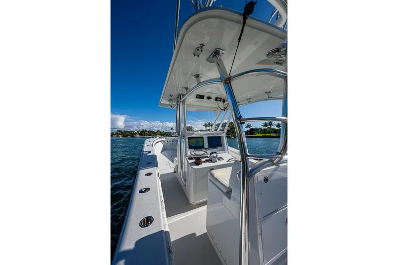 Slide: The Image of 2002 Yellowfin 36 Offshore boat interior with navigation equipment, on a sunny day. - 21