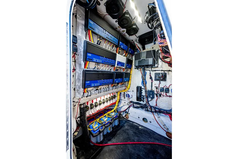 Slide: The Image of Electrical system inside a 2002 Yellowfin 36 Offshore boat, showcasing wiring and components. - 22
