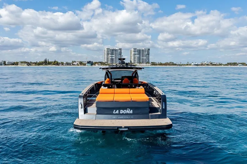 Slide: The Image of 2023 Pardo Yachts 50 with luxurious seating and table on open water. - 18