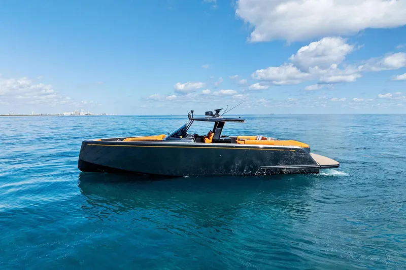 Slide: The Image of 2023 Pardo Yachts 50 luxury deck with orange seating, ocean view, and blue sky. - 19