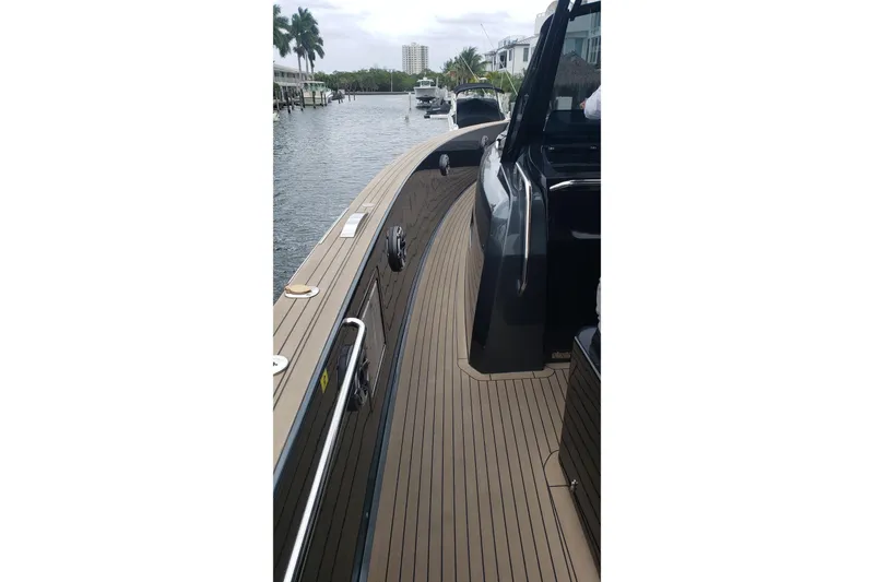 Slide: The Image of 2023 Pardo Yachts 50 cruising on clear blue ocean under a sunny sky. - 2