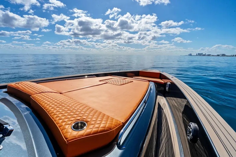 Slide: The Image of Luxurious 2023 Pardo Yachts 50 cockpit with plush orange seating and sleek controls. - 21
