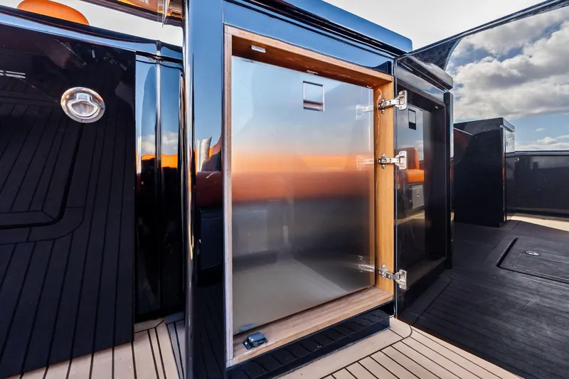 Slide: The Image of Luxury yacht sink area on 2023 Pardo Yachts 50, featuring sleek design and orange seating. - 33