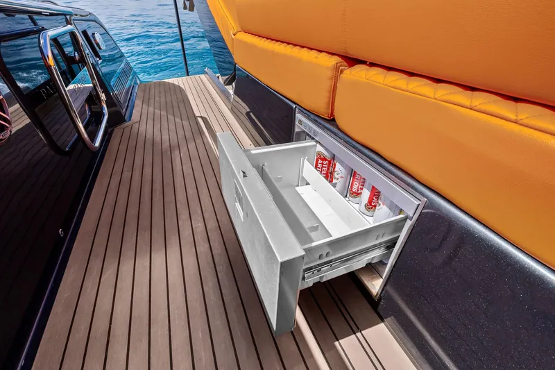 Slide: The Image of Interior of 2023 Pardo Yachts 50 with wall-mounted TV displaying a yacht on water. - 37