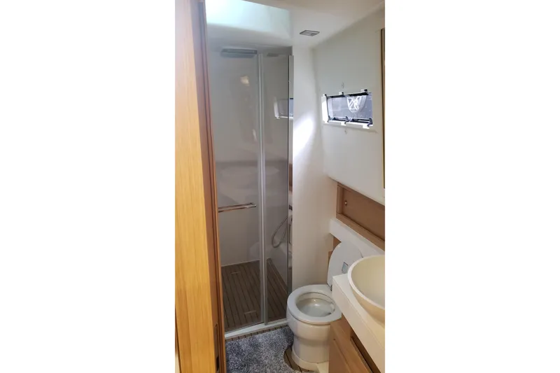 Slide: The Image of 2023 Pardo Yachts 50 cruising on clear blue ocean under a bright sky. - 4