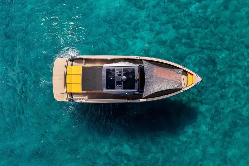 Slide: The Image of Overhead view of 2023 Pardo Yachts 50 on clear turquoise water. - 9