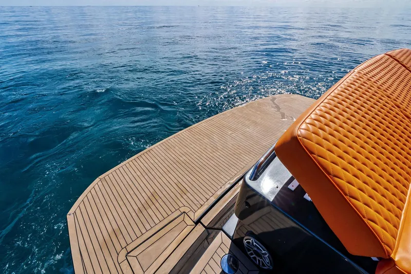 Slide: The Image of Luxury Pardo Yachts 50, 2023 model, with elegant deck and orange seating on open sea. - 35