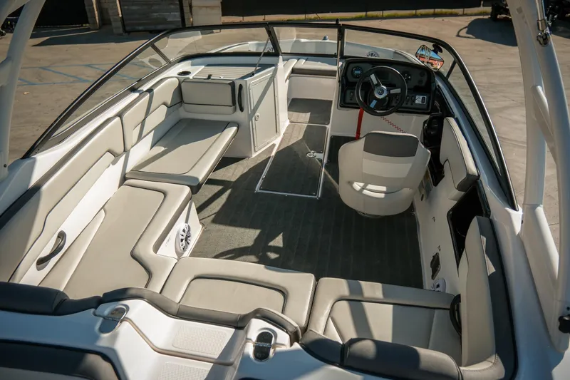 Slide: The Image of 2024 Yamaha Boats AR190 interior with spacious seating and modern dashboard design. - 4
