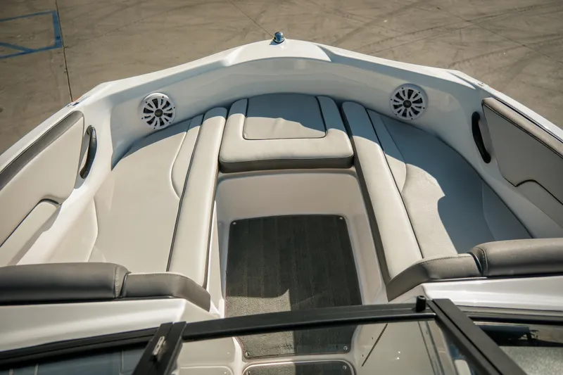 Slide: The Image of 2024 Yamaha AR190 boat interior with cushioned seating and speakers. - 5