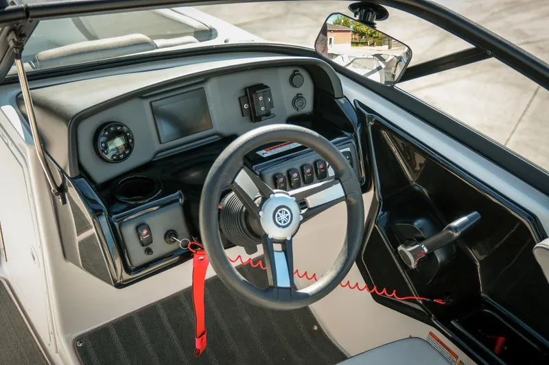 Slide: The Image of 2024 Yamaha Boats AR190 dashboard with steering wheel and control panel. - 8