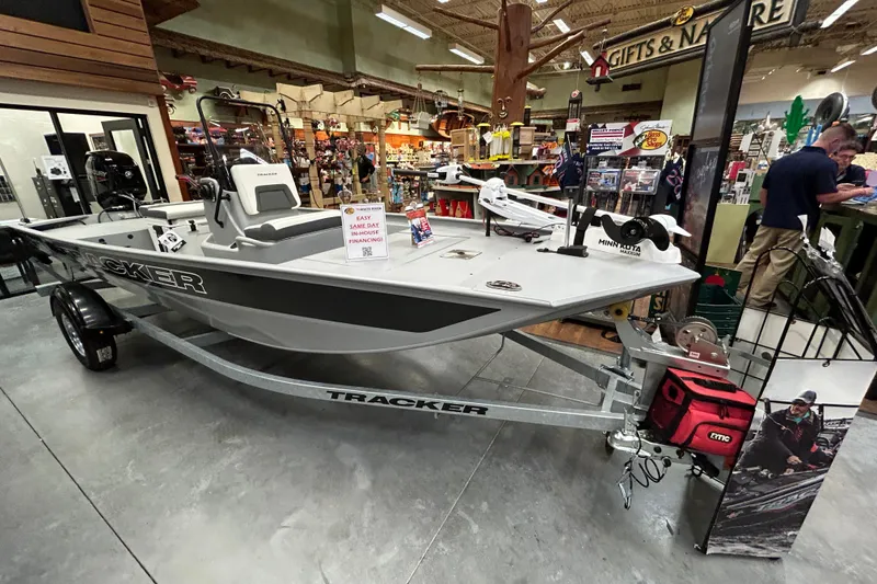 The Image of 2026 Tracker Bass Tracker Classic CC boat displayed in a store with financing options. - 0