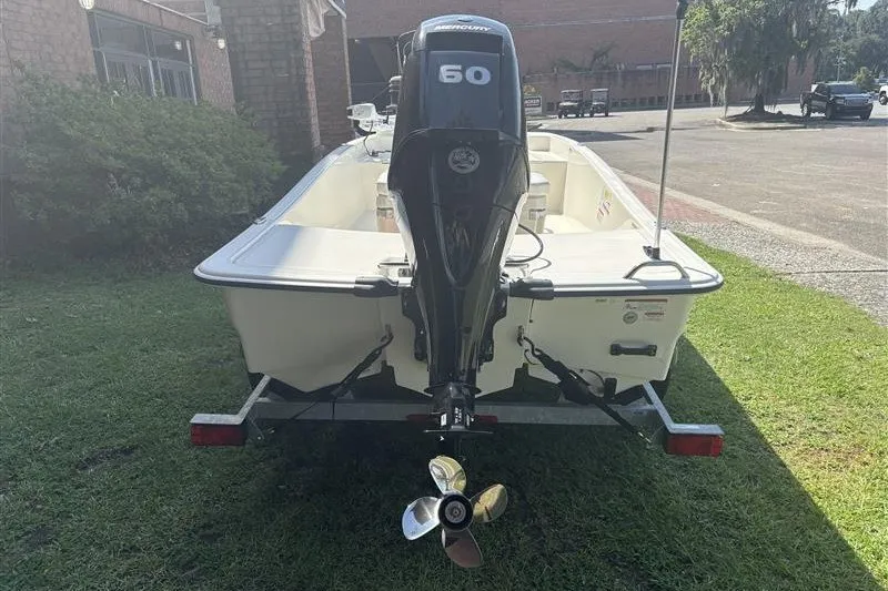 Slide: The Image of 2026 Mako Pro Skiff 15 CC boat with Mercury 60 engine on trailer. - 8