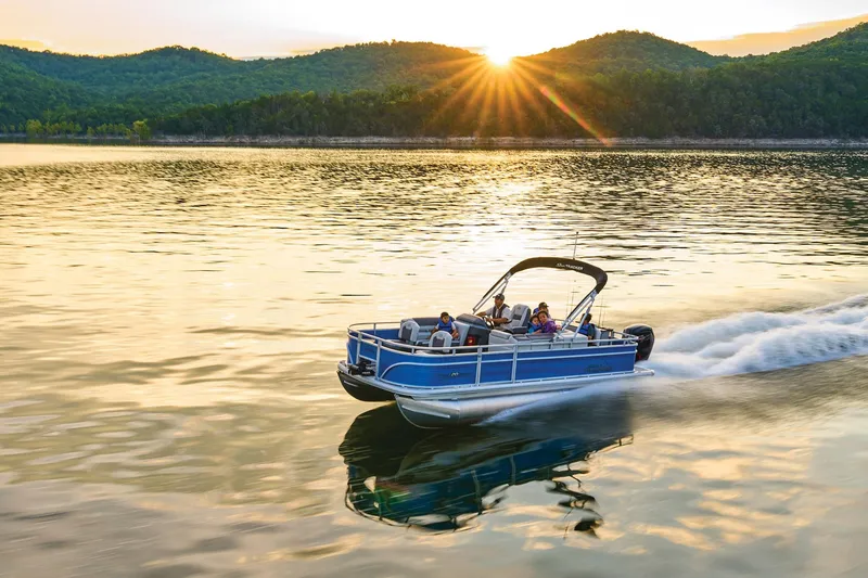 Slide: The Image of 2026 Sun Tracker Fishin' Barge 20 DLX interior with seating and steering console. - 3