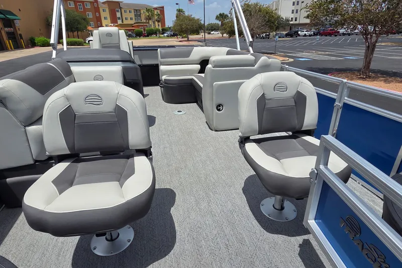 Slide: The Image of 2026 Sun Tracker Fishin' Barge 20 DLX interior with comfortable seating and modern design. - 16