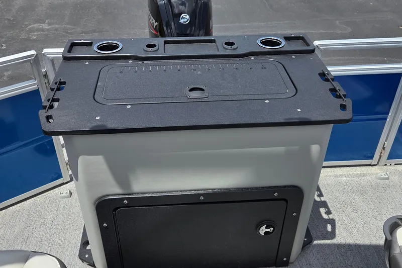 Slide: The Image of 2026 Sun Tracker Fishin' Barge 20 DLX fishing station with storage and cup holders. - 15