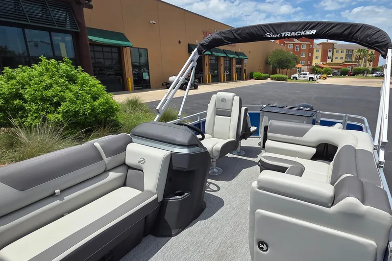 Slide: The Image of 2026 Sun Tracker Fishin' Barge 20 DLX pontoon boat with spacious seating and canopy. - 13