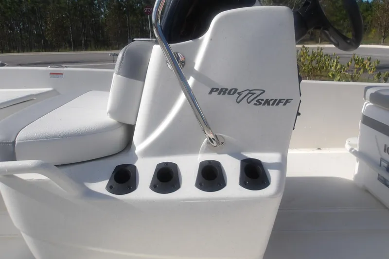 Slide: The Image of 2026 Mako Pro Skiff 17 CC boat console with rod holders and seating. - 8