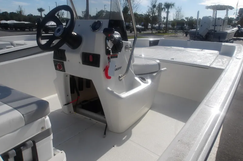 Slide: The Image of 2026 Mako Pro Skiff 17 CC boat interior with steering console and seating. - 15