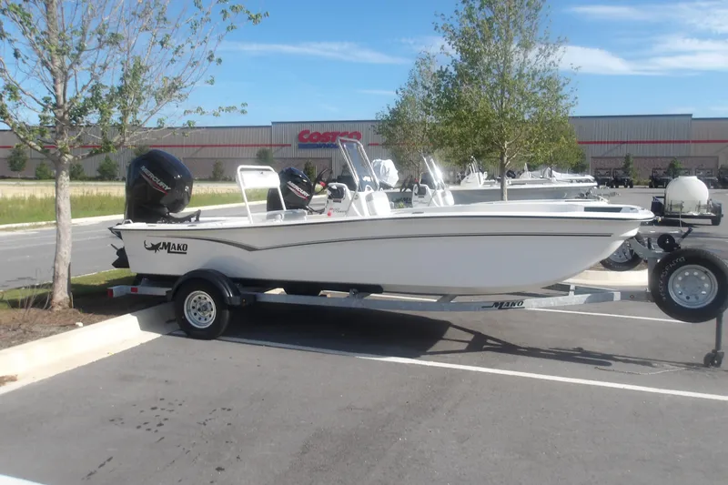 The Image of 2026 Mako Pro Skiff 17 CC boat on trailer in parking lot near Costco. - 1