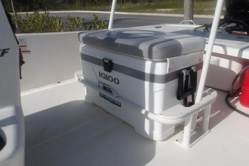 Slide: The Image of 2026 Mako Pro Skiff 17 CC boat interior with Igloo cooler seat. - 9
